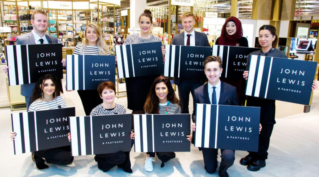 John Lewis partners people with logo boards