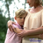 Boy being comforted by mother - Grief Encounter Bereavement Support